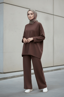 Hijabi model wearing brown set with white sneakers