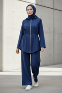 Hijabi model wearing navy blue hooded set