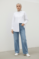 Hijabi - plain white outdoor wall